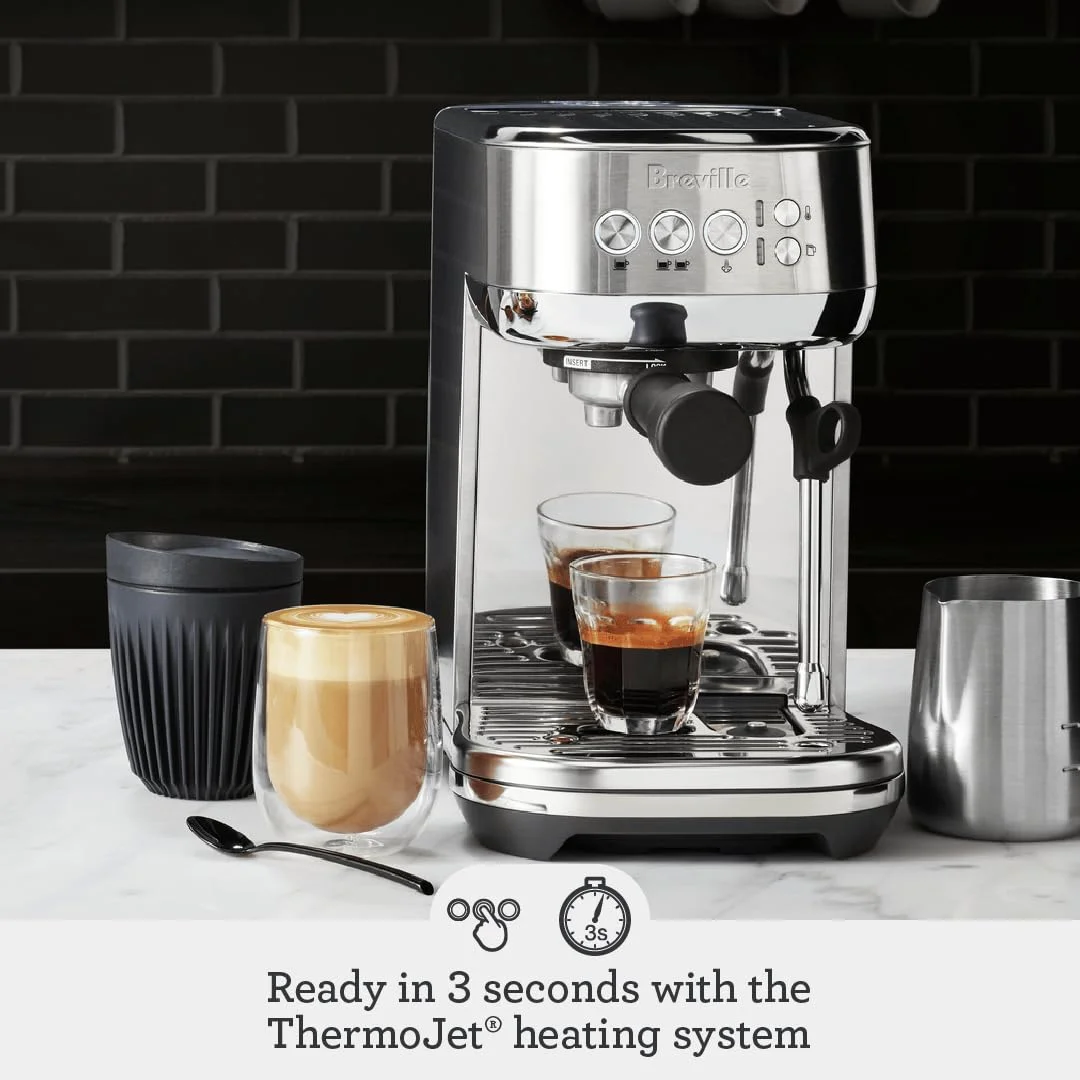 Close-up of the Breville Bambino Plus portafilter and brewing head