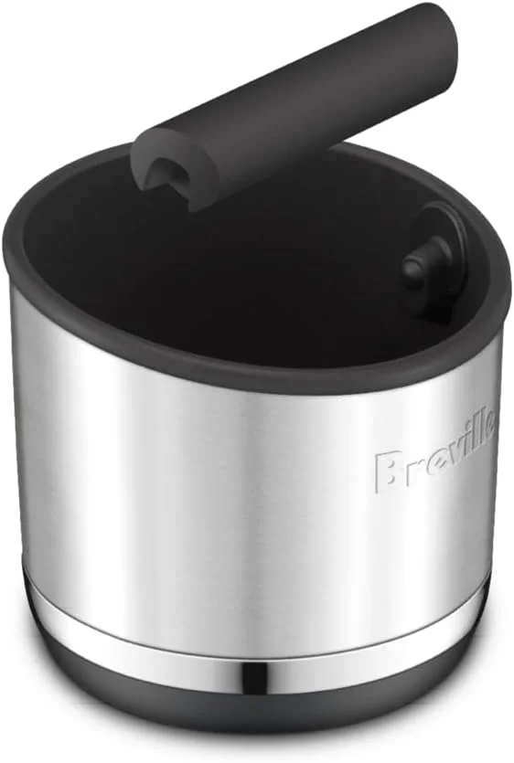 Breville Knock Box 10 showcasing its compact size on an espresso machine drip tray