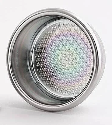 The 22g E&B Lab by IMS Nanoquartz basket next to a 58mm portafilter