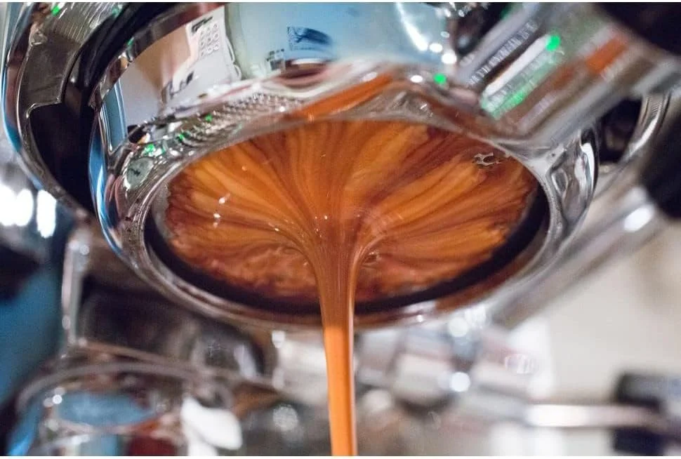 Beautifully extracted espresso with rich crema flowing from a bottomless portafilter