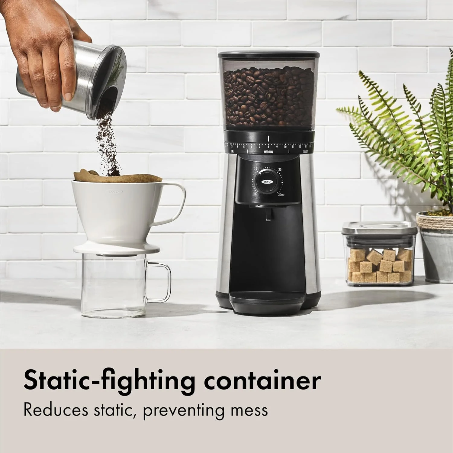 One-touch start button on OXO Brew coffee grinder